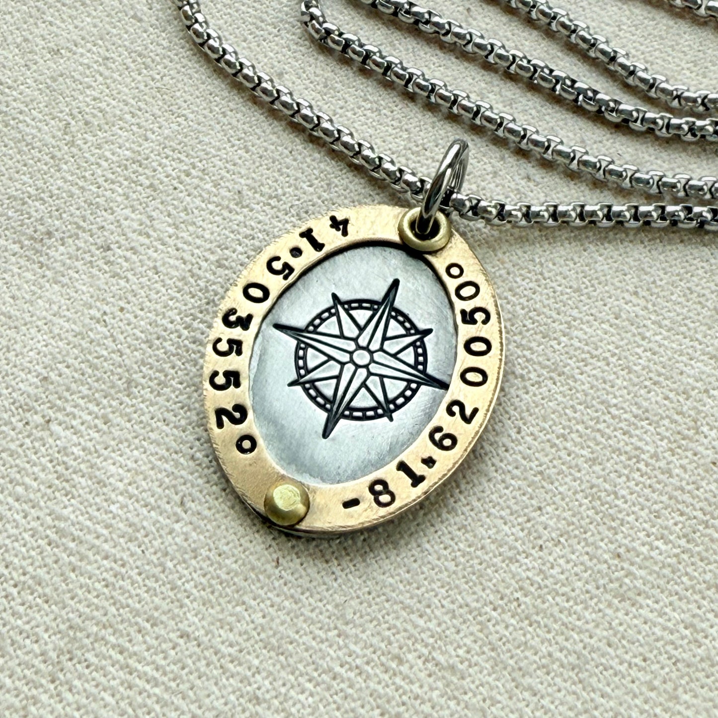 Oval Gold Rimmed custom coordinates necklace with compass rose at center hand stamped and riveted by hand - drake designs jewelry