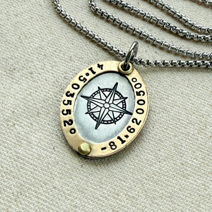 Oval Gold Rimmed custom coordinates necklace with compass rose at center hand stamped and riveted by hand - drake designs jewelry