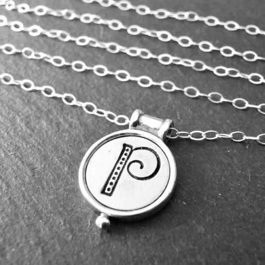 whimsical initial necklace with raised edge in sterling silver - drake designs jewelry