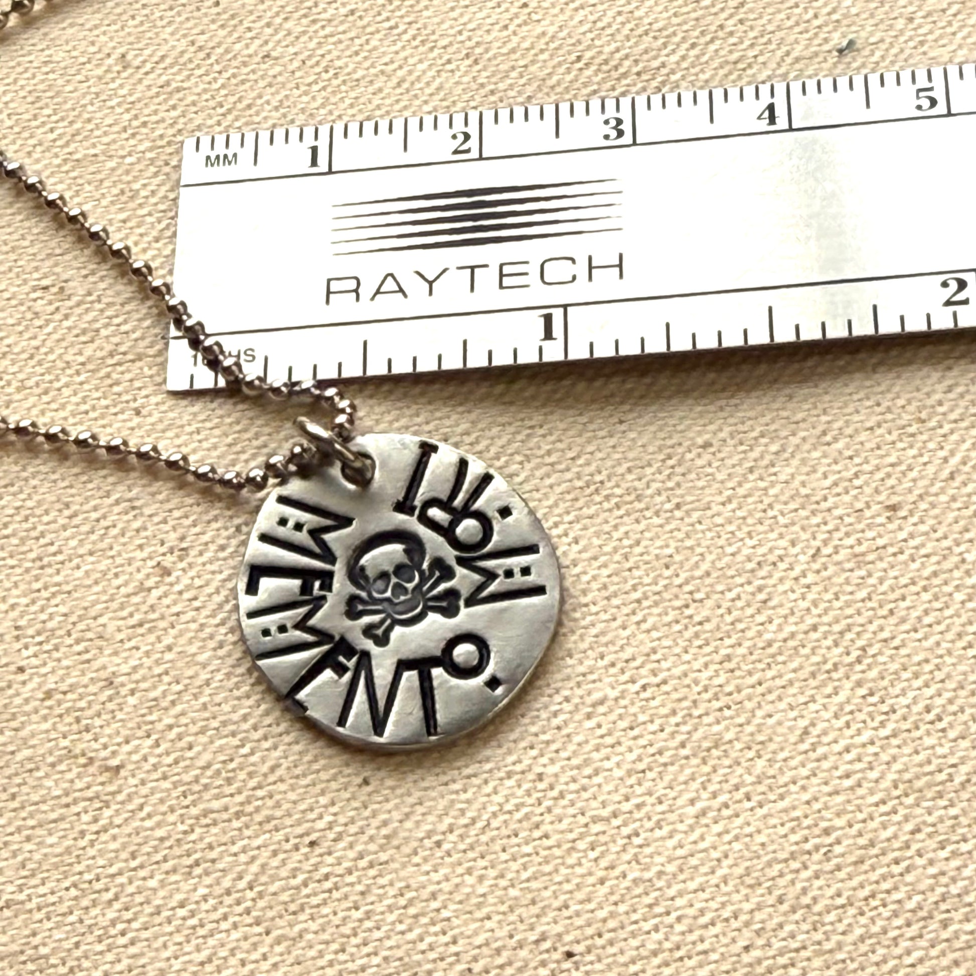 Memento mori Latin Phrase Necklace with skull and crossbones. Hand-stamped_ Drake designs jewelry