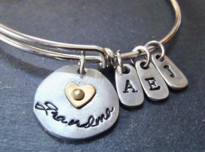 Personalized grandma bracelet - mixed metal adjustable bangle with grandkids initials and gold heart on Grandma charm - Drake Designs Jewelry