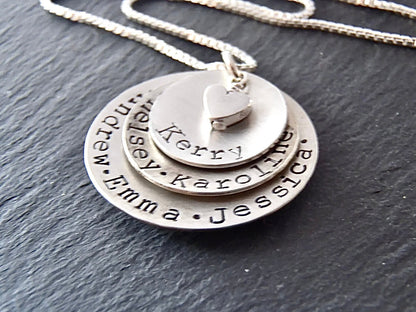 Layered mom necklace with names. Hand crafted from solid Sterling silver, slightly concave with a heart nestled at the center - Drake Designs Jewelry