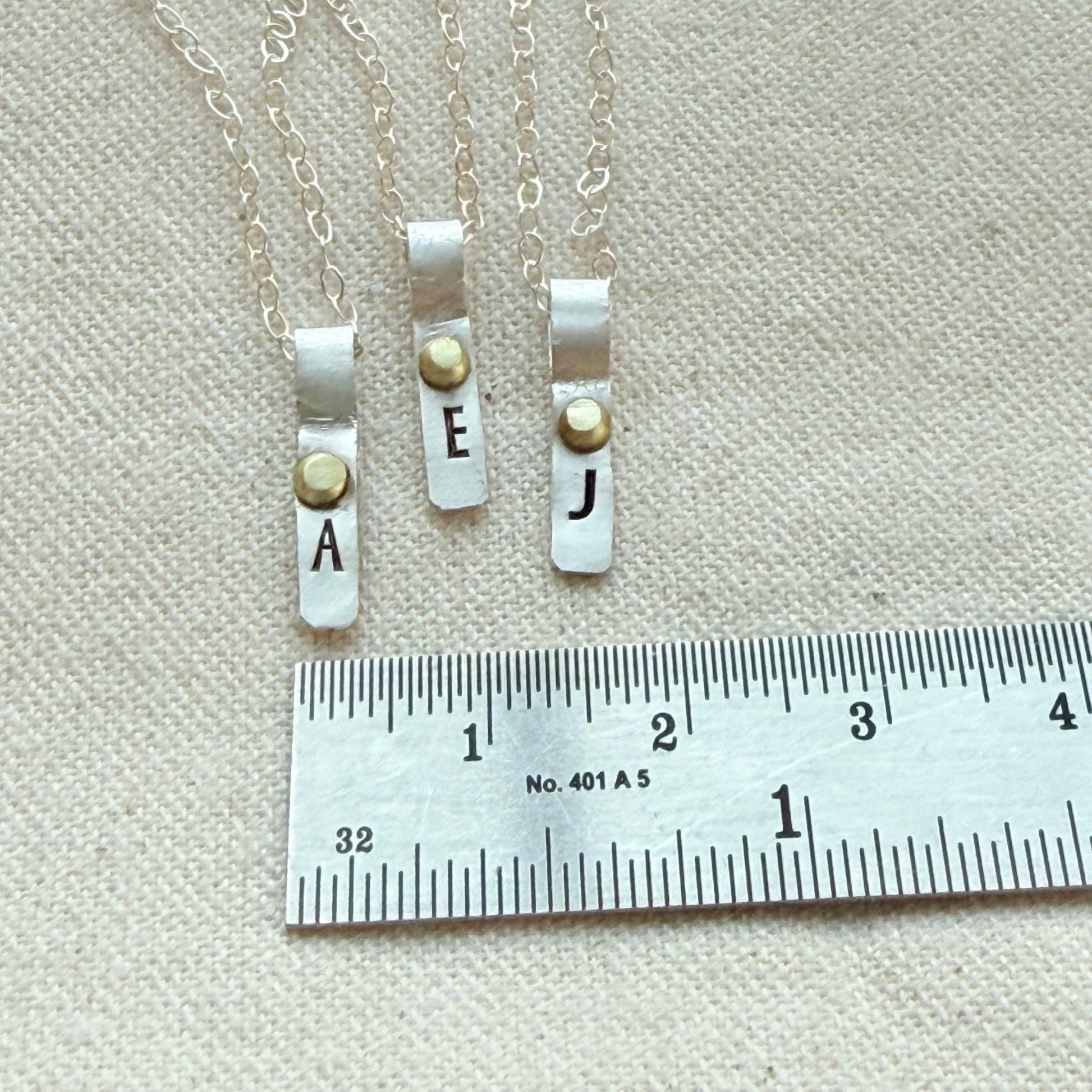 Teeny Tiny Sterling Silver Initial Charm Necklace with Hand Riveted Golden Accents | Art Deco Initial - drake designs jewelry