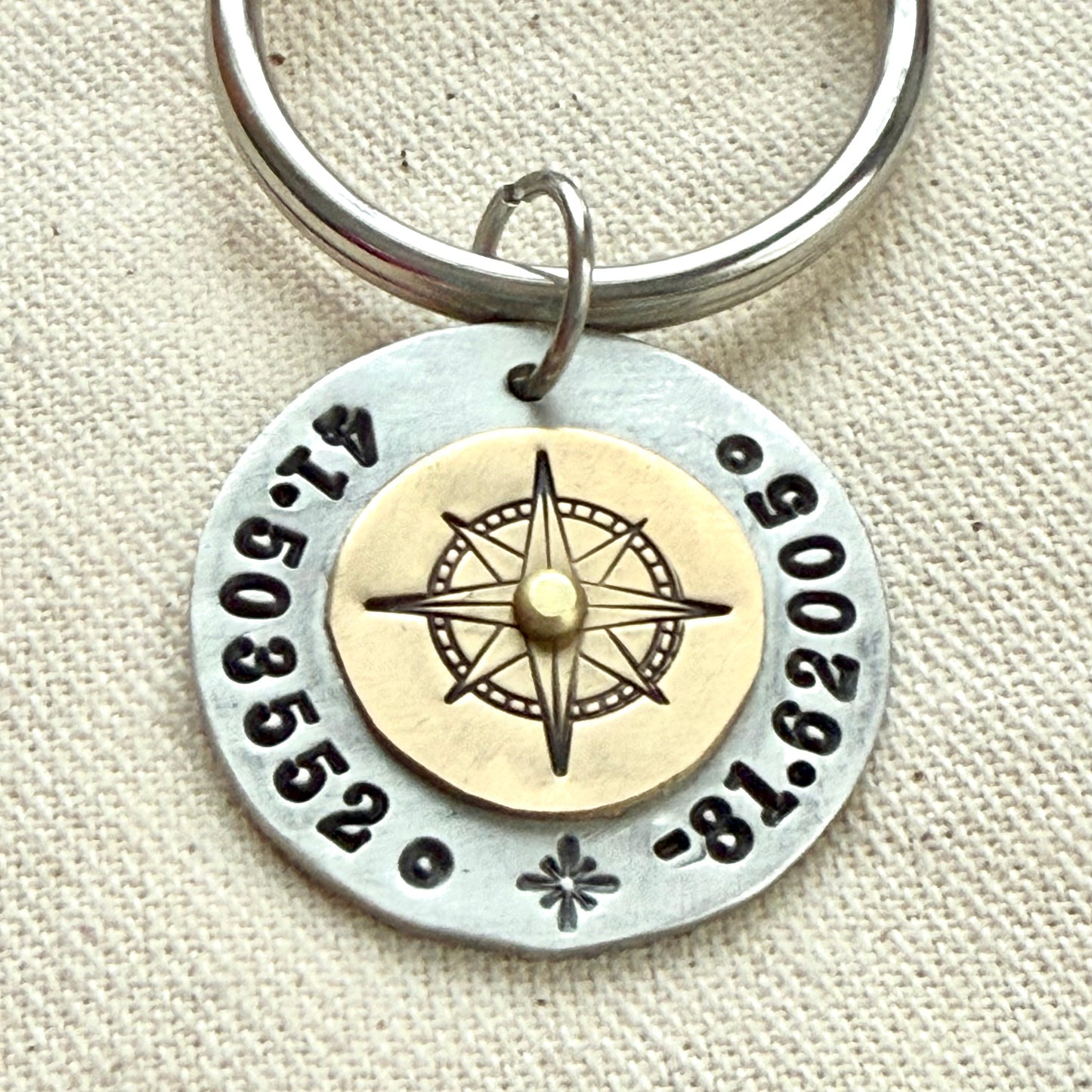 Custom coordinates keychain with gold compass riveted to silver pendant - hand stamped with personalized latitude and longitude - Drake designs jewelry