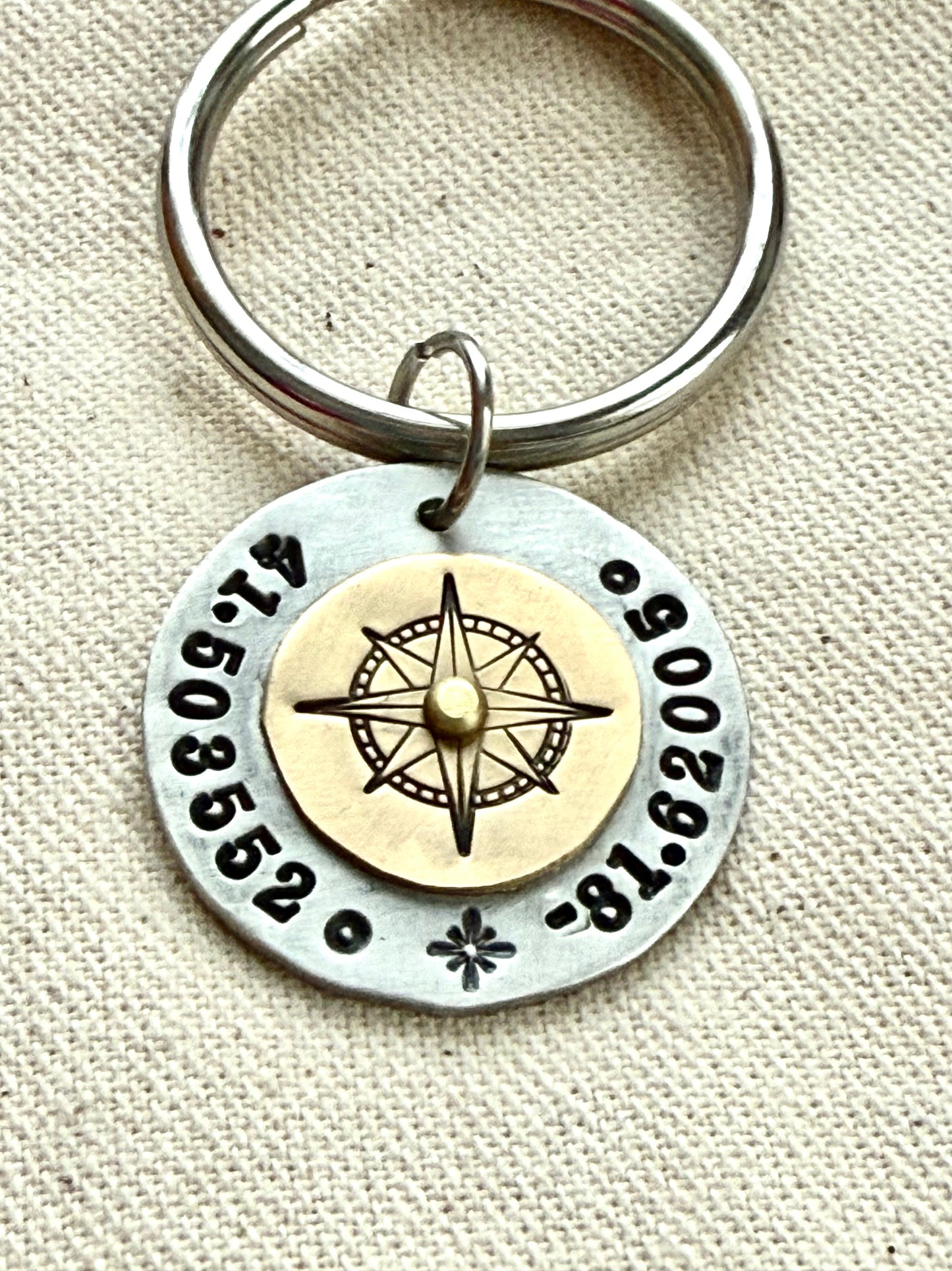 Custom coordinates key chain with gold compass riveted to silver pendant - hand stamped with personalized latitude and longitude - Drake designs jewelry