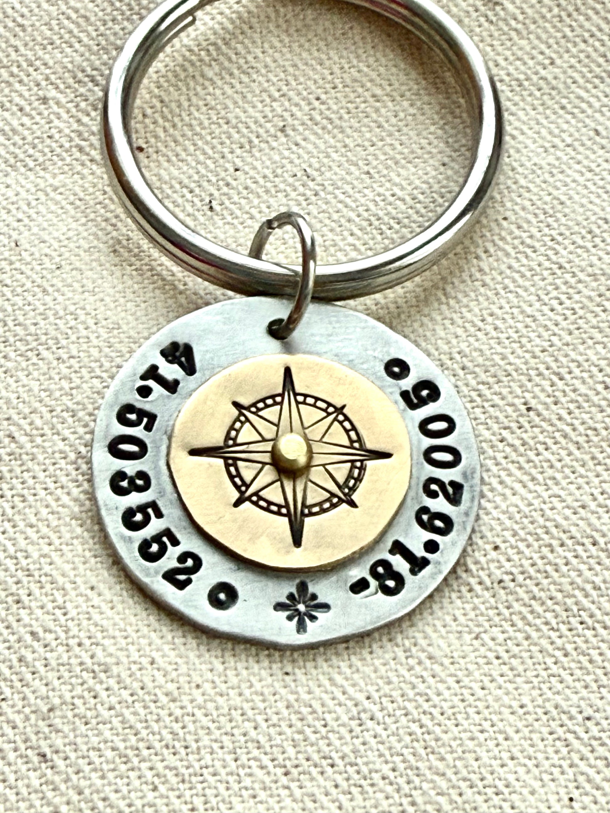Custom coordinates key chain with gold compass riveted to silver pendant - hand stamped with personalized latitude and longitude - Drake designs jewelry