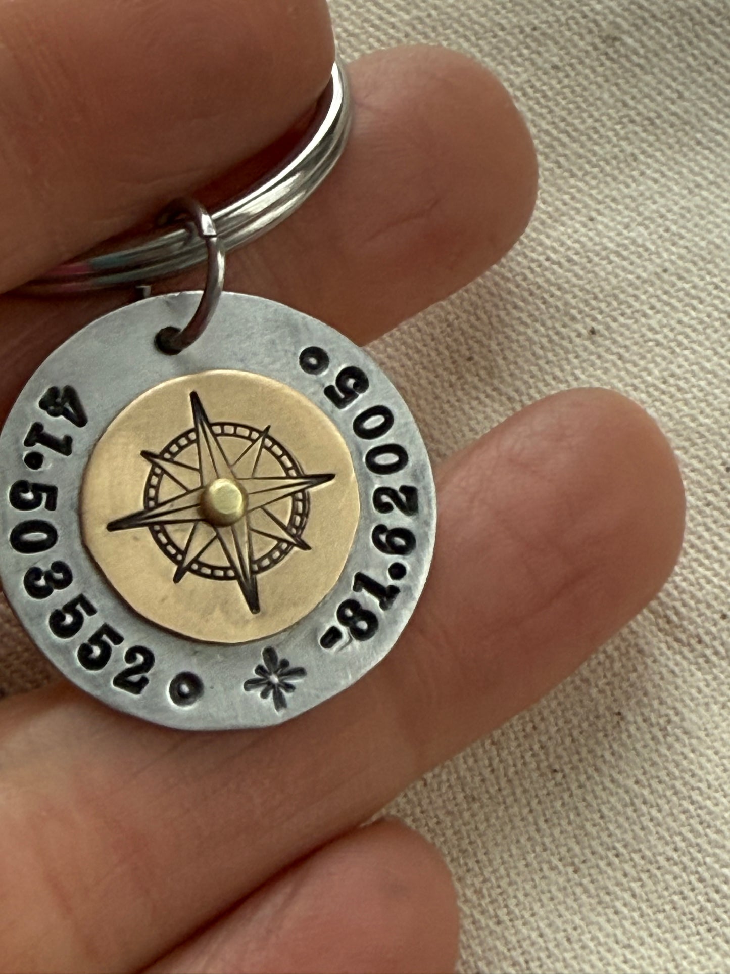 Custom coordinates key chain with gold compass riveted to silver pendant - hand stamped with personalized latitude and longitude - Drake designs jewelry