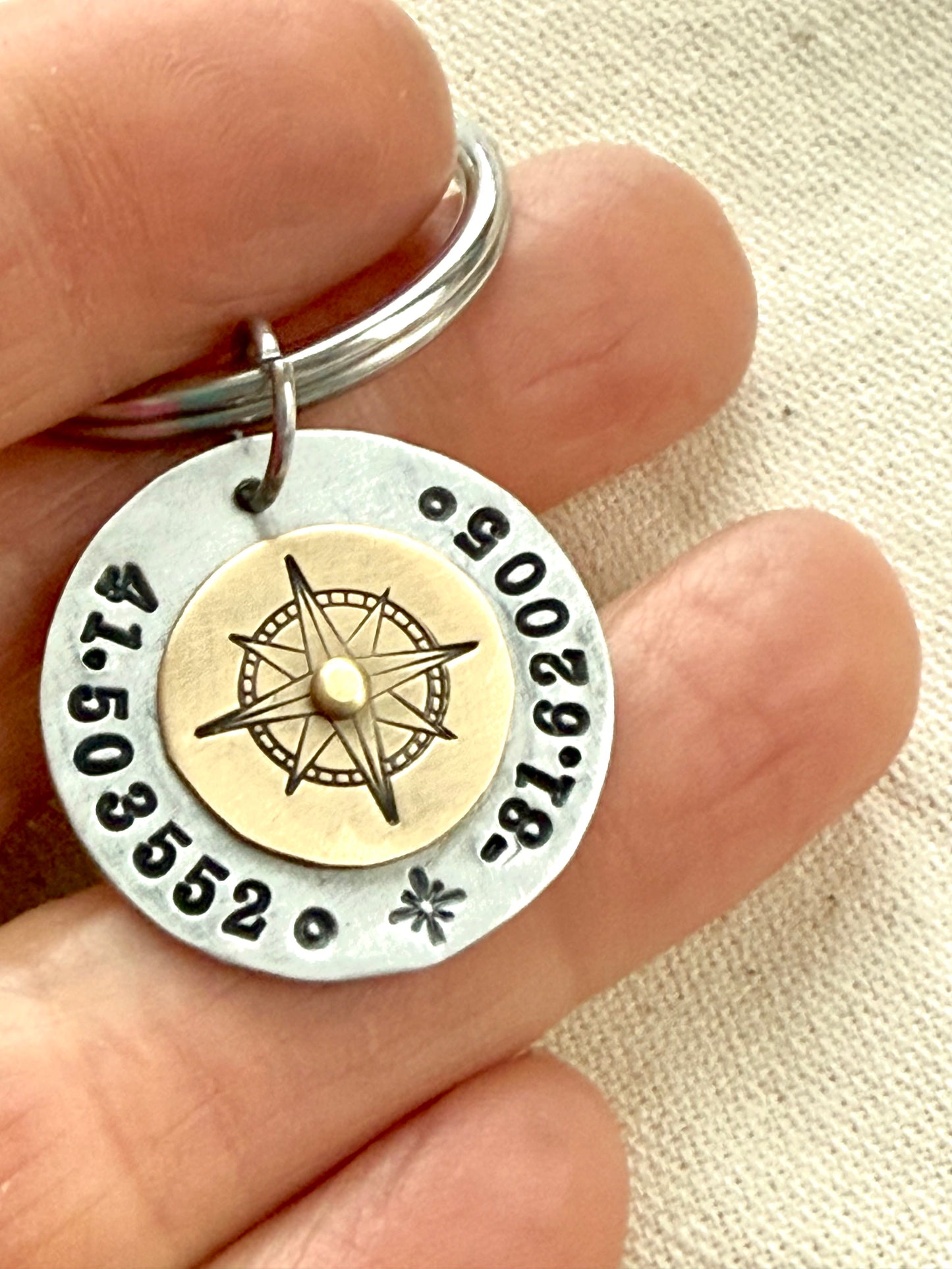 Custom coordinates keychain with gold compass riveted to silver pendant - hand stamped with personalized latitude and longitude - Drake designs jewelry