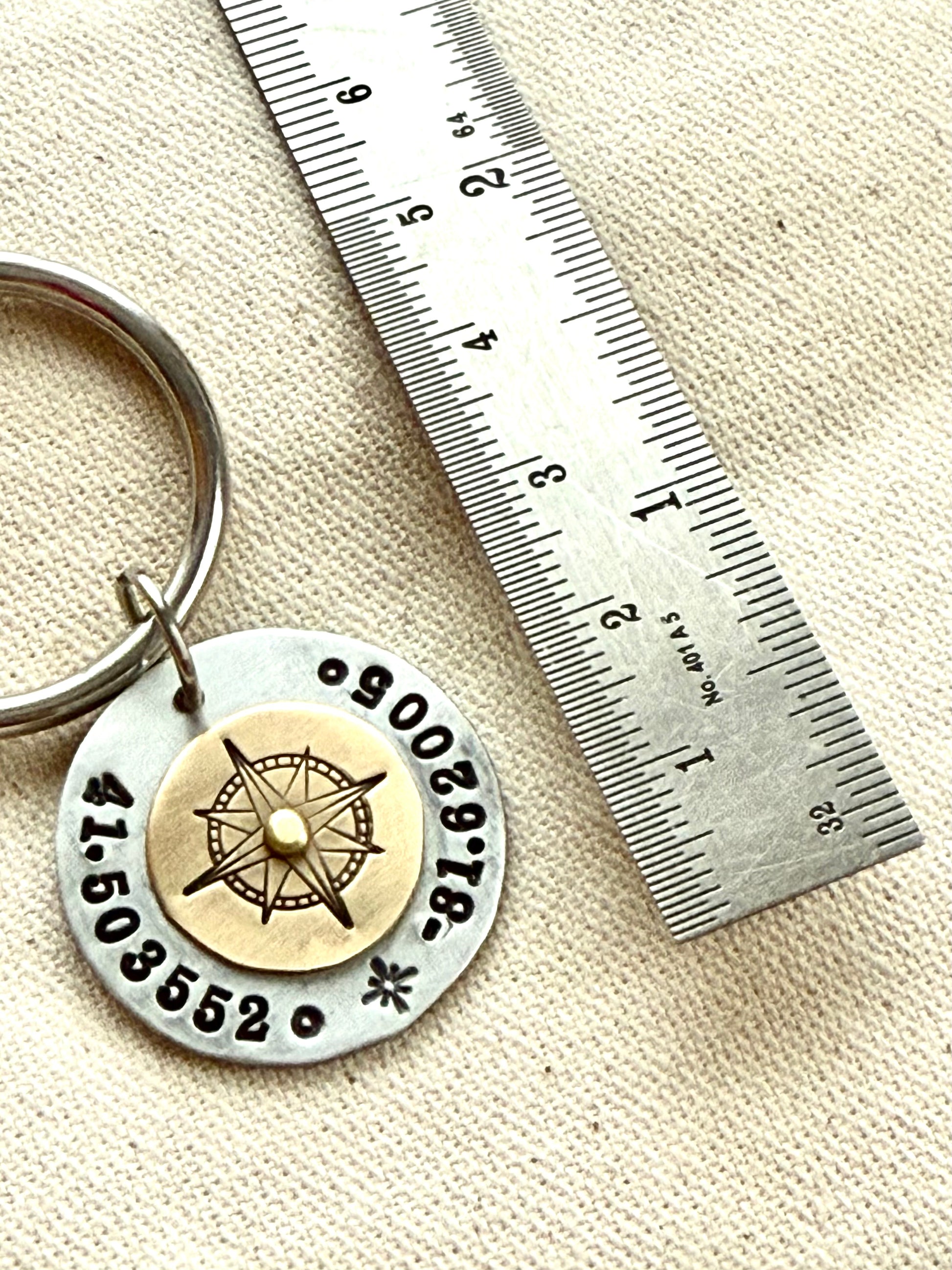 Custom coordinates key chain with gold compass riveted to silver pendant - hand stamped with personalized latitude and longitude - Drake designs jewelry