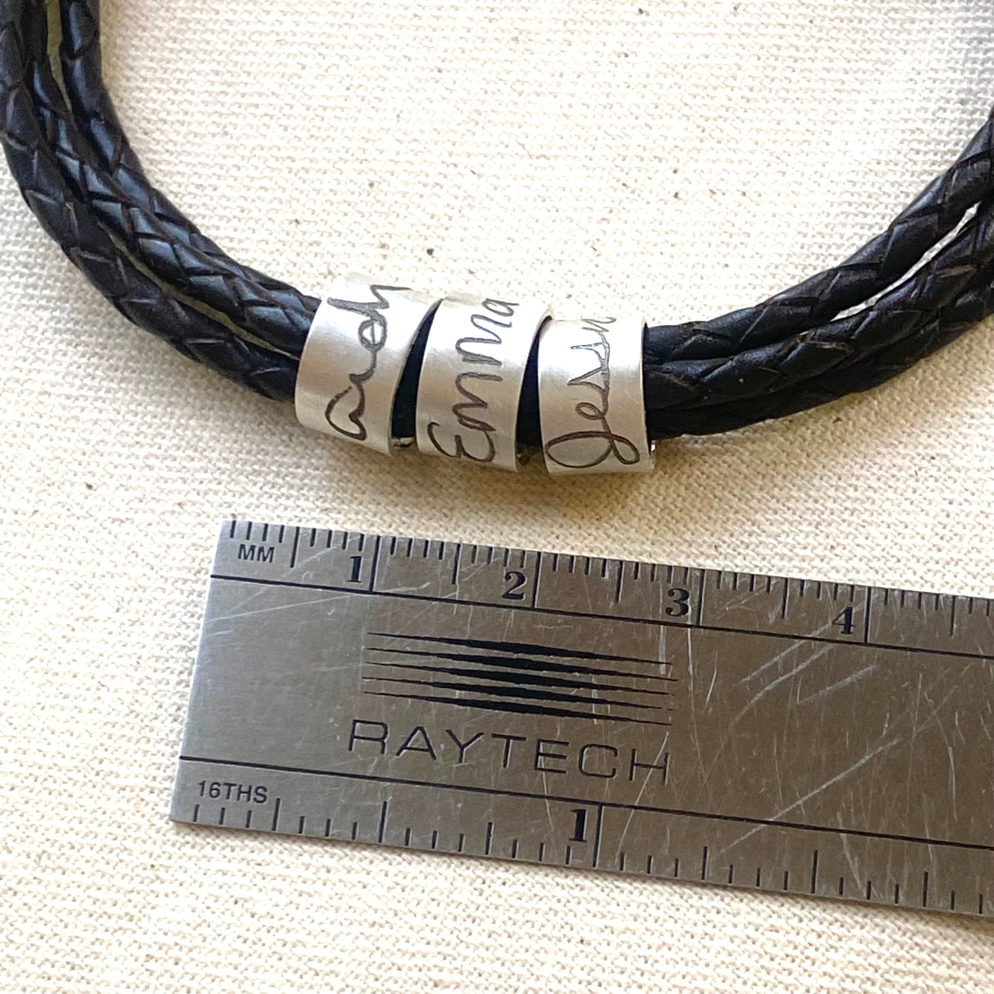 personalized actual handwriting bracelet.  custo handwriting engraved on sterling silver riveted pendant on triple wrapped braided leather - drake designs jewelry