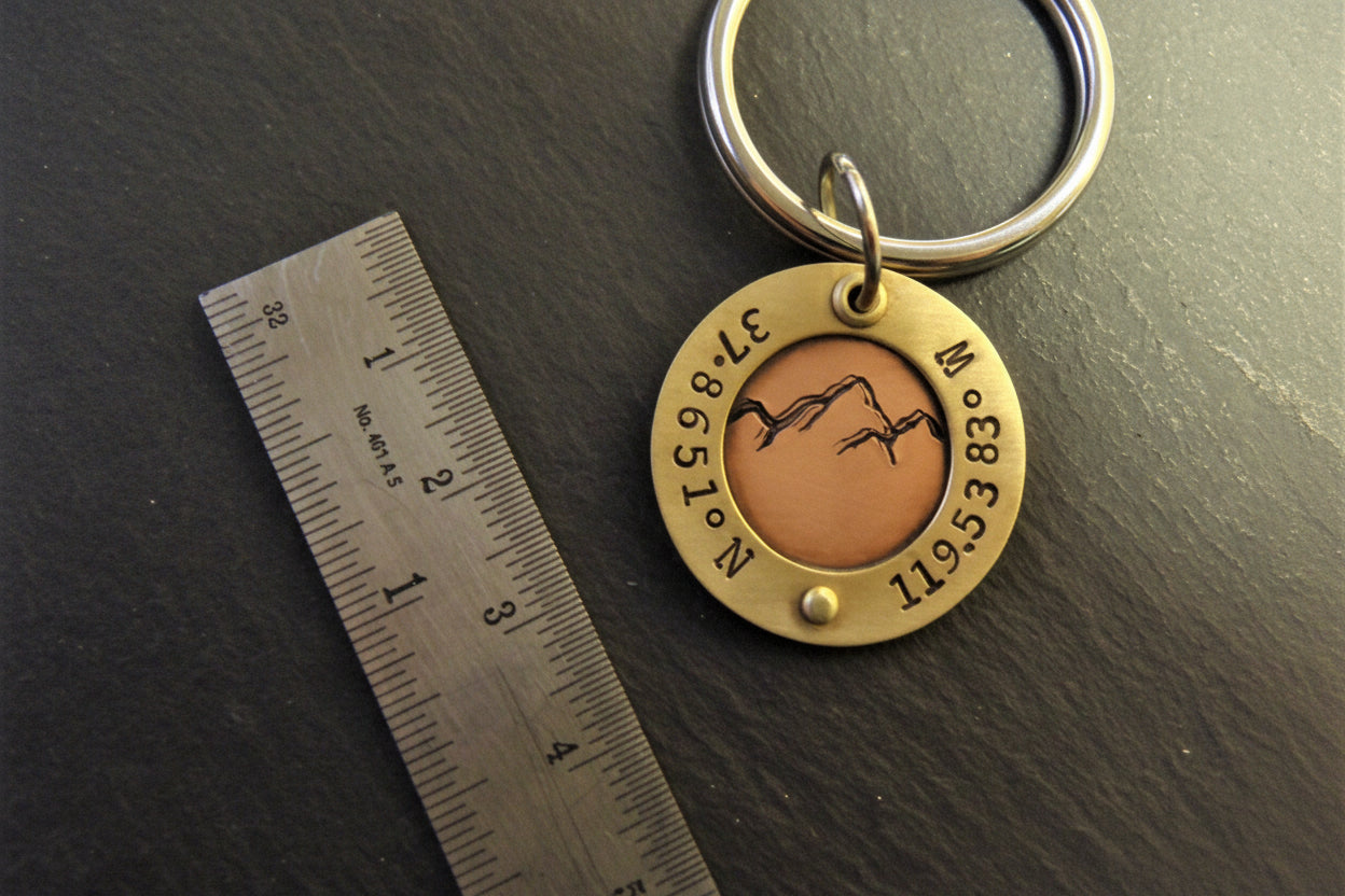 custom mountain keychain with personalized coordinates in mixed metal gold and copper - drake designs jewelry