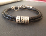 Mens Braided leather bracelet with family names.  Personalized sterling silver charms are hand made with family names for women or men - Drake Designs Jewelry