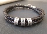Mens bracelet with family names is hand crafted with 4mm braided leather and sterling silver charms. - Drake Designs Jewelry