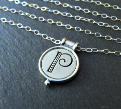 A sterling silver necklace with a personalized initial pendant on a cable chain - drake designs jewelry