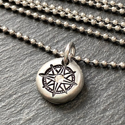 silver pebble compass necklace with hand set crystal at center - drake designs jewelry