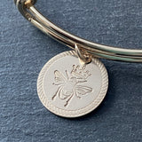 14k gold fill queen bee bracelet with rope edge border stamped on pendant. drake designs jewelry