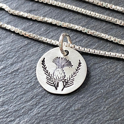 Scottish thistle necklace hand stamped in sterling silver with a brushed finish. drake designs jewelry