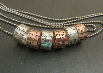 sterling silver or copper charms are personalized with latitude longitude coordinates - Drake Designs Jewelry