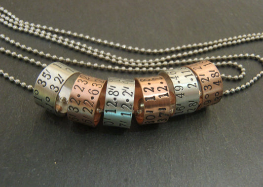 sterling silver or copper charms are personalized with latitude longitude coordinates - Drake Designs Jewelry