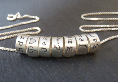 mom necklace with kids names on hand crafted sterling silver ring charms with your choice of font. drake designs jewelry