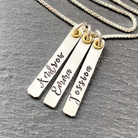 thick sterling silver mom bar necklace with kids names hand stamped and gold accent. drake designs jewelry