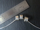 tiny sterling silver ring charms riveted with childrens names. drake designs jewelry