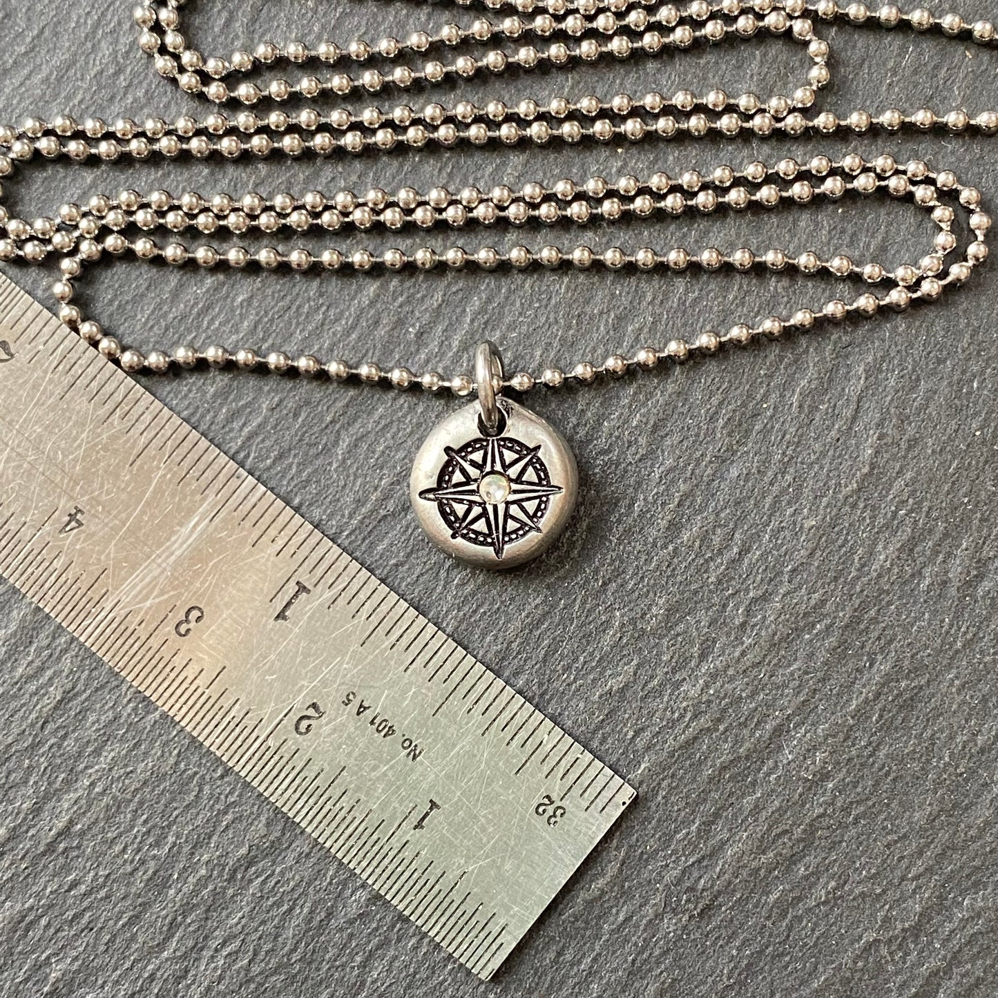 silver pebble compass necklace with hand set crystal at center - drake designs jewelry