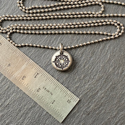 silver pebble compass necklace with hand set crystal at center - drake designs jewelry