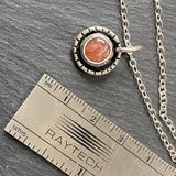 Sterling silver sunstone necklace. Sun with rays created with recycled sterling silver and genuine sunstone is hand set into hand made bezel. Sparkly orange sunstone necklace - drake designs jewelry