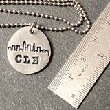 Cleveland skyline necklace hand stamped CLE on organically shaped pewter pendant-  Drake Designs Jewelry
