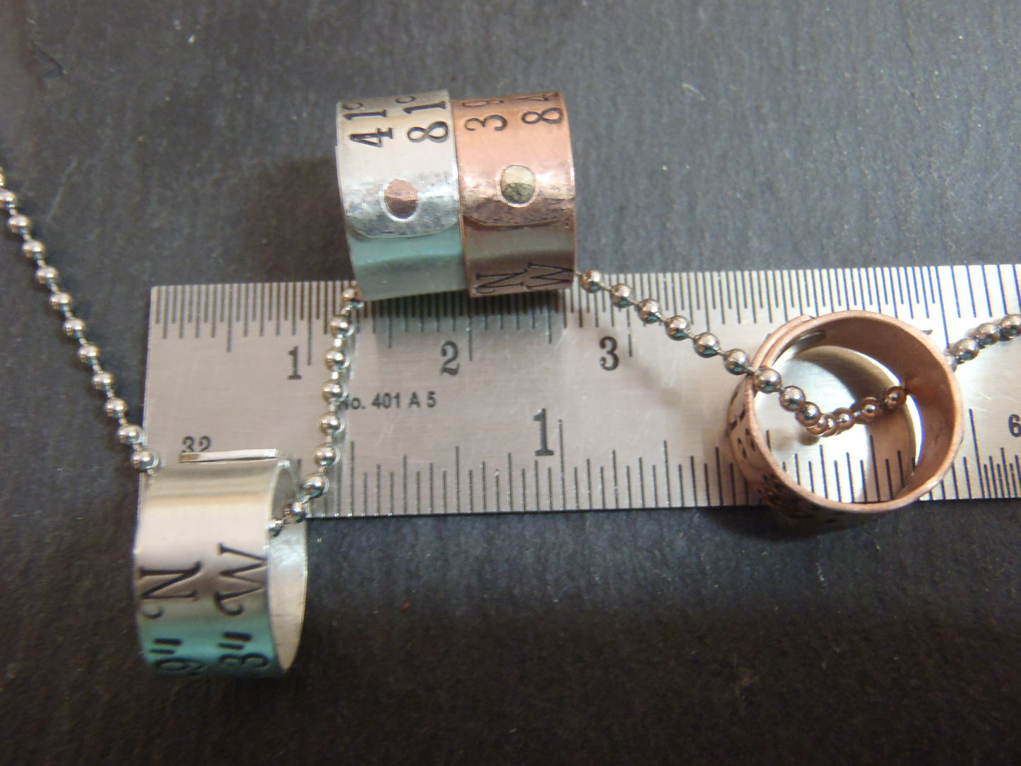 sterling silver or copper charms are personalized with latitude longitude coordinates - Drake Designs Jewelry