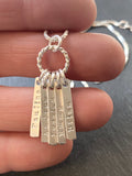 sterling silver mom necklace with kids names hand stamped on tiny thick rectangle charms on twisted wire ring - drake designs jewelry