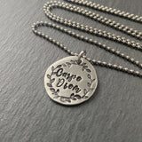 Carpe Diem necklace hand stamped in script font with hand stamped border. seize the day drake designs jewelry