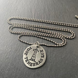 Latin phrase necklace hand crafted with pewter on stainless steel chin and stamped lighthouse. post tenebras lux necklace. after darkness, light. drake designs jewelry