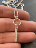 mom necklace with kids names hand stamped on tiny thick sterling silver rectangle charms on textured rope ring - drake designs jewelry