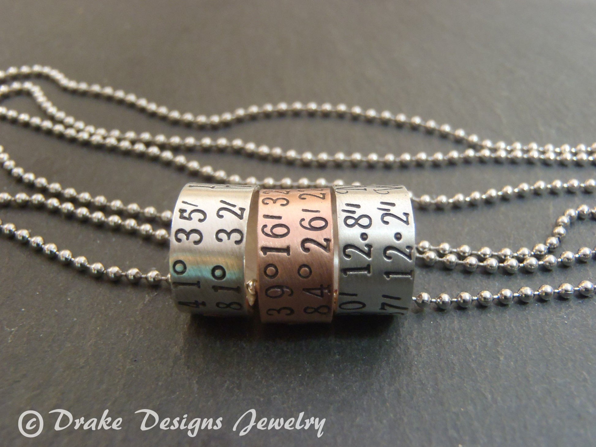 sterling silver or copper charms are personalized with latitude longitude coordinates - Drake Designs Jewelry