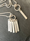 sterling silver mom necklace with kids names hand stamped on tiny thick rectangle charms on rope ring - drake designs jewelry