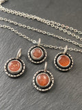 Sterling silver sunstone necklace. Sun with rays created with recycled sterling silver and genuine sunstone is hand set into hand made bezel. Sparkly orange sunstone necklace - drake designs jewelry