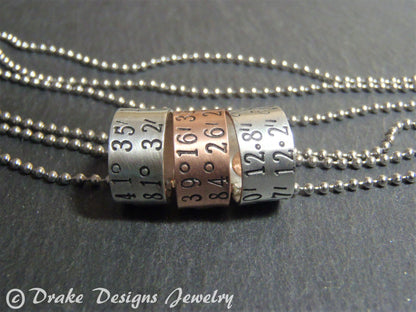 sterling silver or copper charms are personalized with latitude longitude coordinates - Drake Designs Jewelry