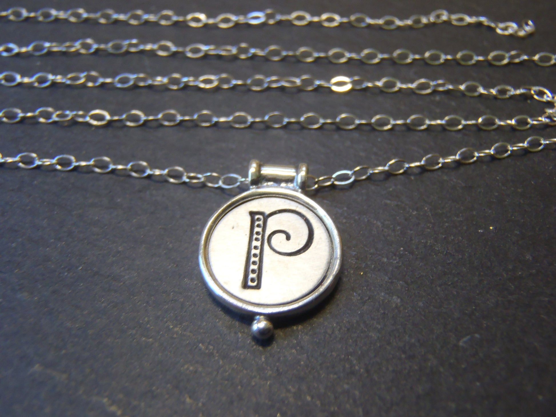 whimsical initial necklace with raised edge in sterling silver - drake designs jewelry