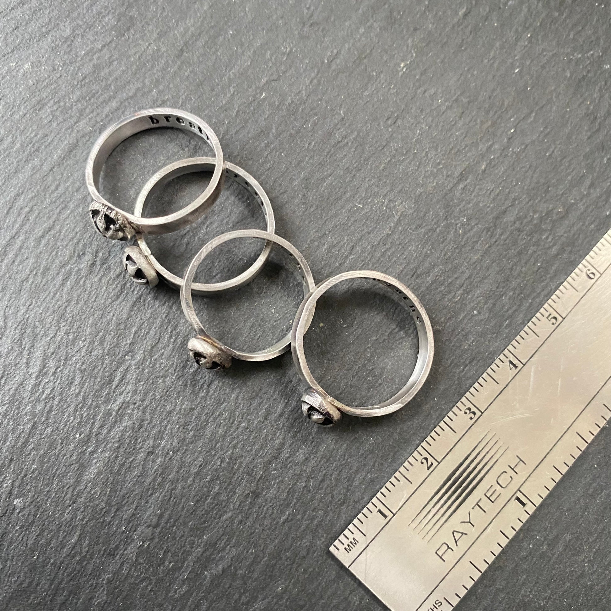 sterling silver lotus flower stacking ring with 'breathe' hand stamped inside, irregular organic shape from melted sterling silver metal - drake designs jewelry 