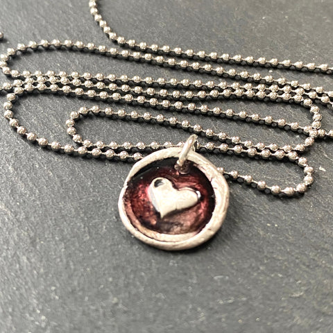 tiny red heart wax seal necklace. organically shaped hand crafted .999 fine silver necklace with red resin. drake designs jewelry