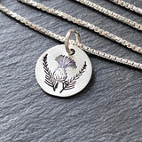 Hand stamped Scottish thistle necklace in sterling silver with a brushed finish. drake designs jewelry