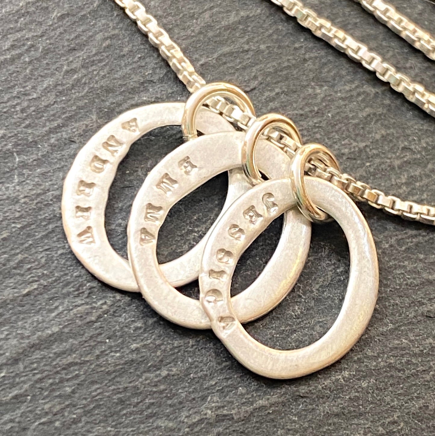 sterling silver hand stamped mom necklace with kids names on tiny organic oval ring charms- drake designs jewelry