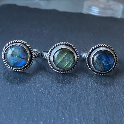 sterling silver labradorite ring hand crafted with rope band .  Labradorite with flash is hand set in sterling silver bezel - drake designs jewelry