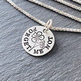 sterling silver forget me not necklace.  remembrance gift for sympathy and loss. hand stamped sterling silver with a brushed finish. Drake designs jewelry
