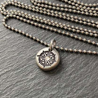 silver pebble compass necklace with hand set crystal at center - drake designs jewelry