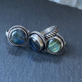 sterling silver labradorite ring hand crafted with rope band .  Labradorite with flash is hand set in sterling silver bezel - drake designs jewelry