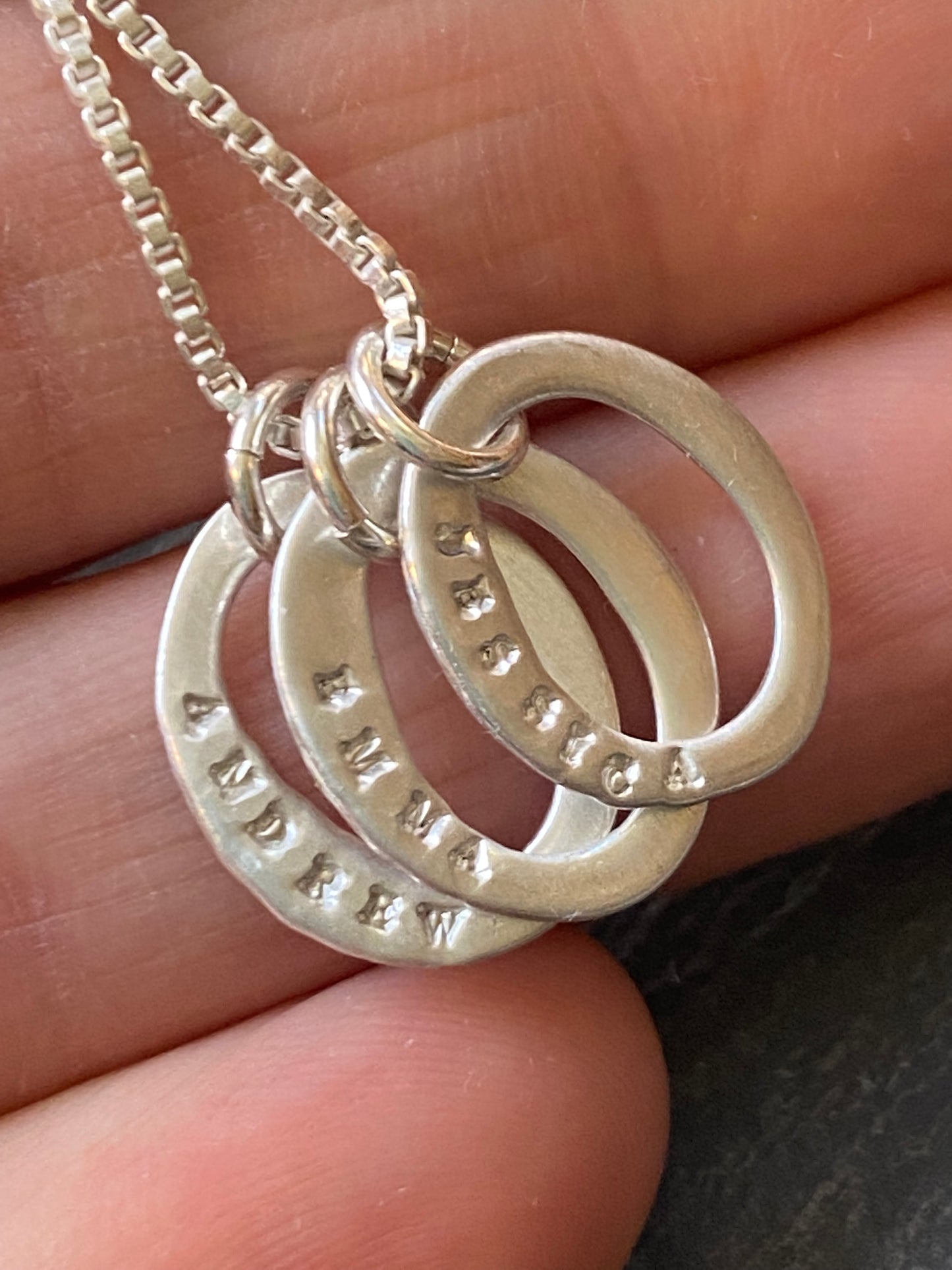 sterling silver mom necklace with hand stamped kids names on oval ring charms- drake designs jewelry