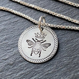 Queen bee necklace with rope border in sterling silver with a brushed finish. drake designs jewelry